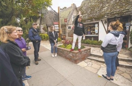 Gael Gallagher leads a tour group on a two-hour stroll of Carmel, including hidden courtyards.